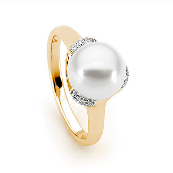 A round freshwater pearl ring with diamond accents, crafted in 9ct gold.