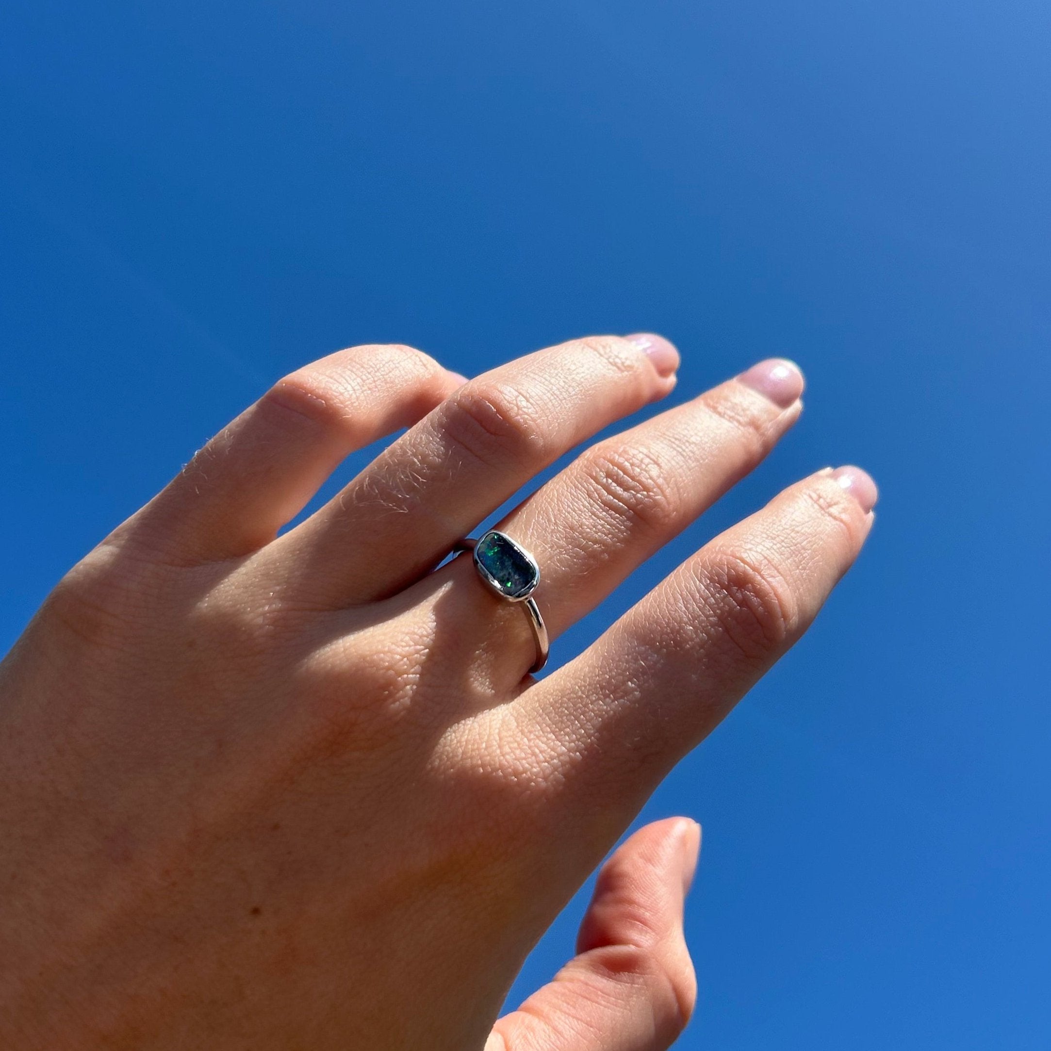 opal ring on model hand