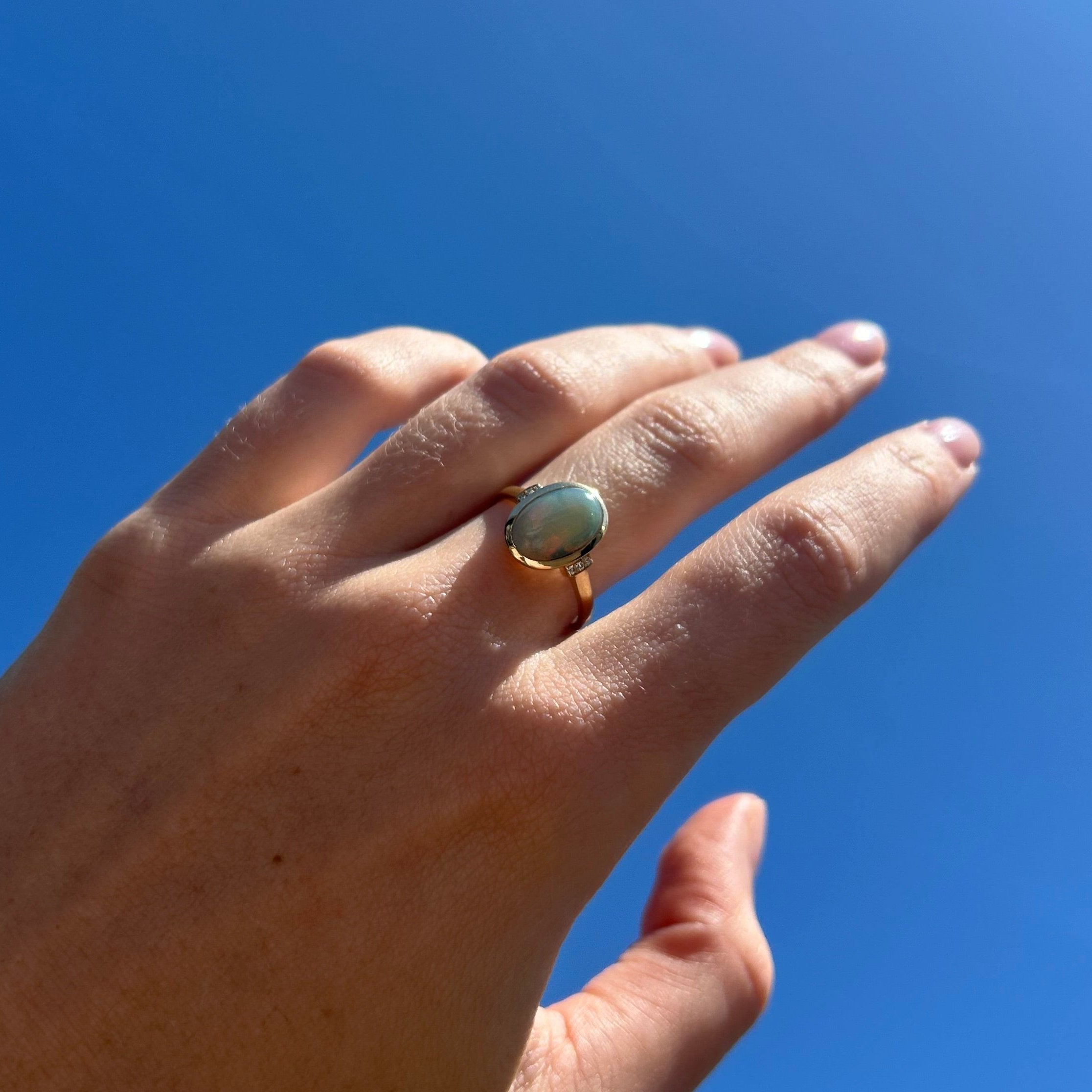 opal ring on model hand