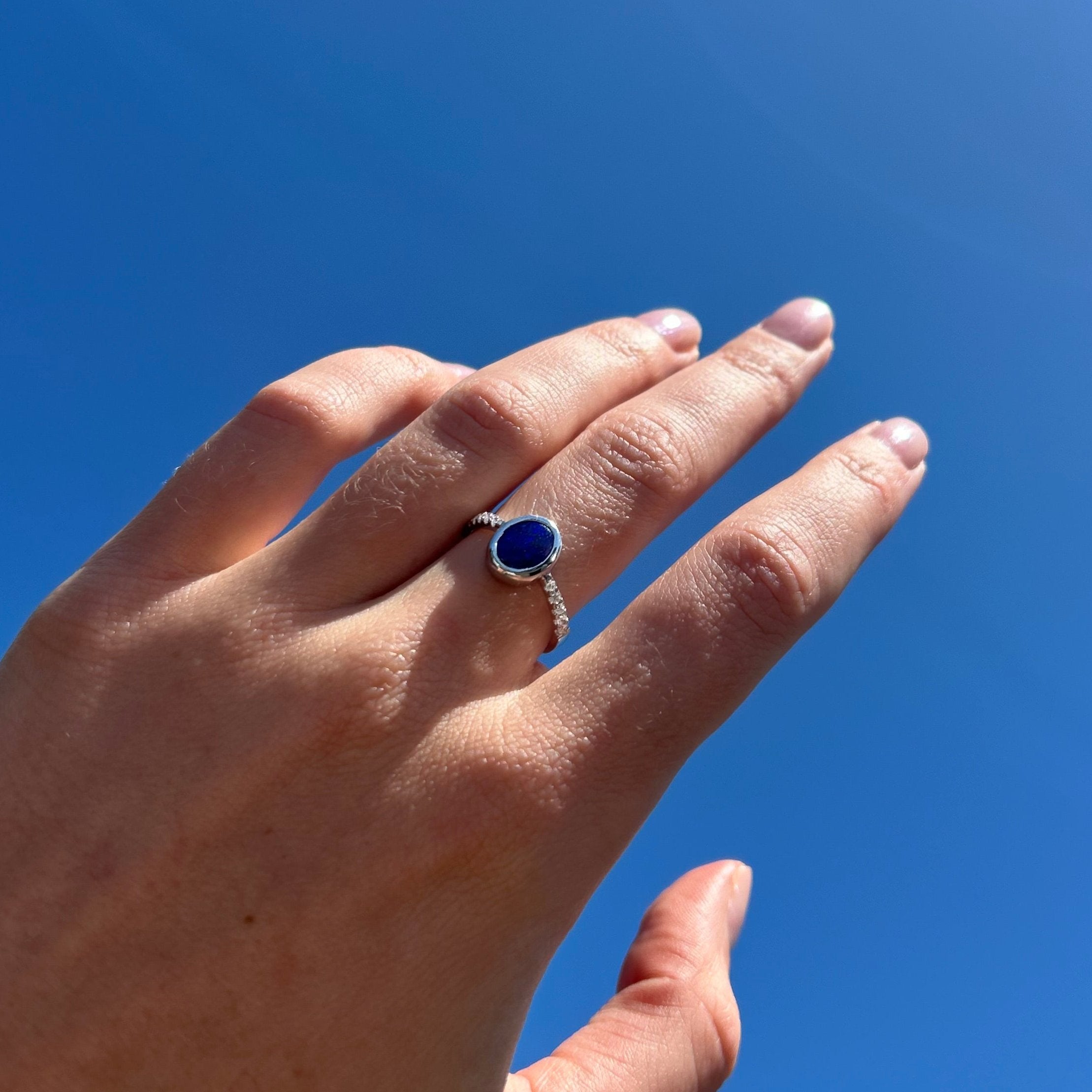 opal ring on model hand