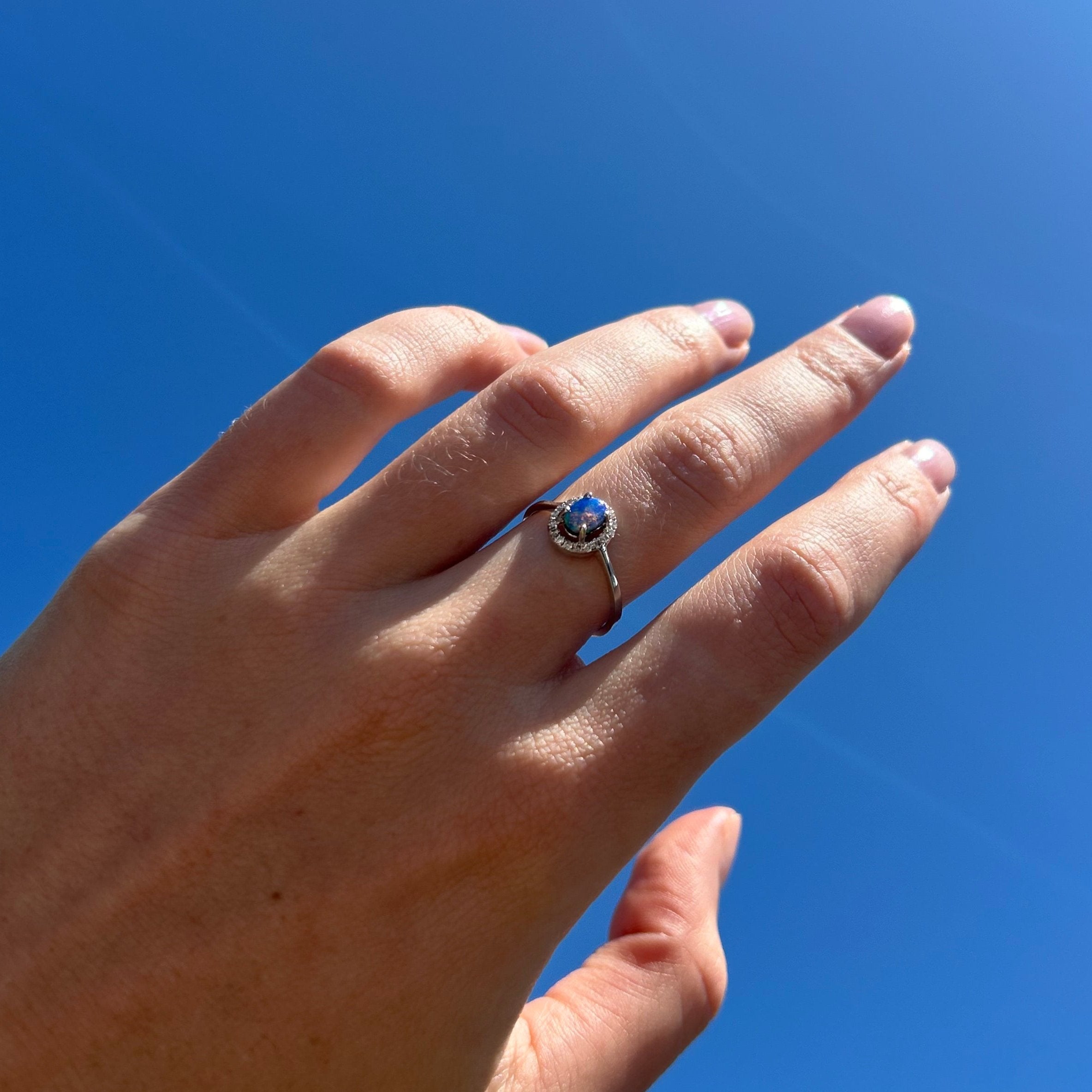 opal ring on model hand